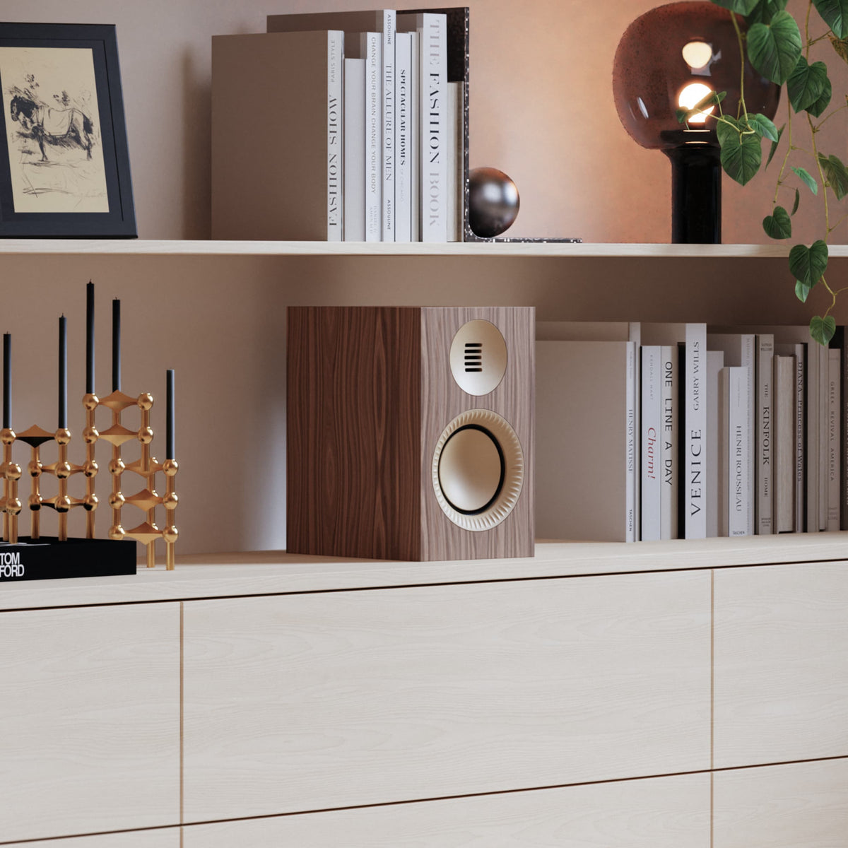 A modern wood-grain Tuk Passive speaker, displayed on a light wood cabinet in a styled home interior setting.