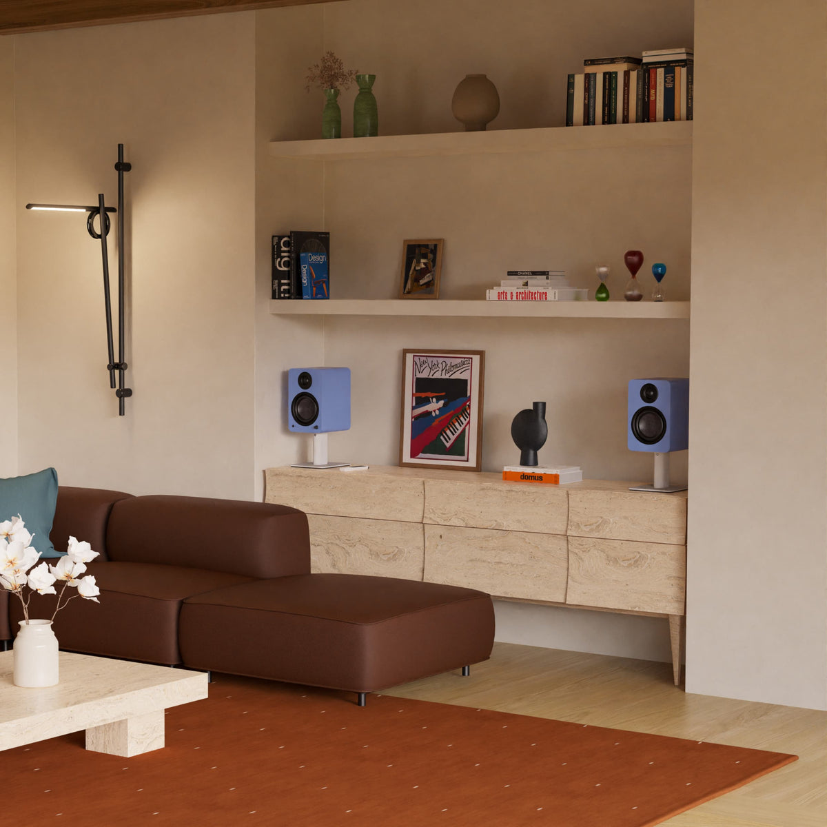 A modern living room interior featuring a brown leather sectional sofa, a light wood cabinet with two blue Yu6 speakers.